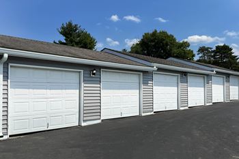 A row of garage doors on the side of a building
